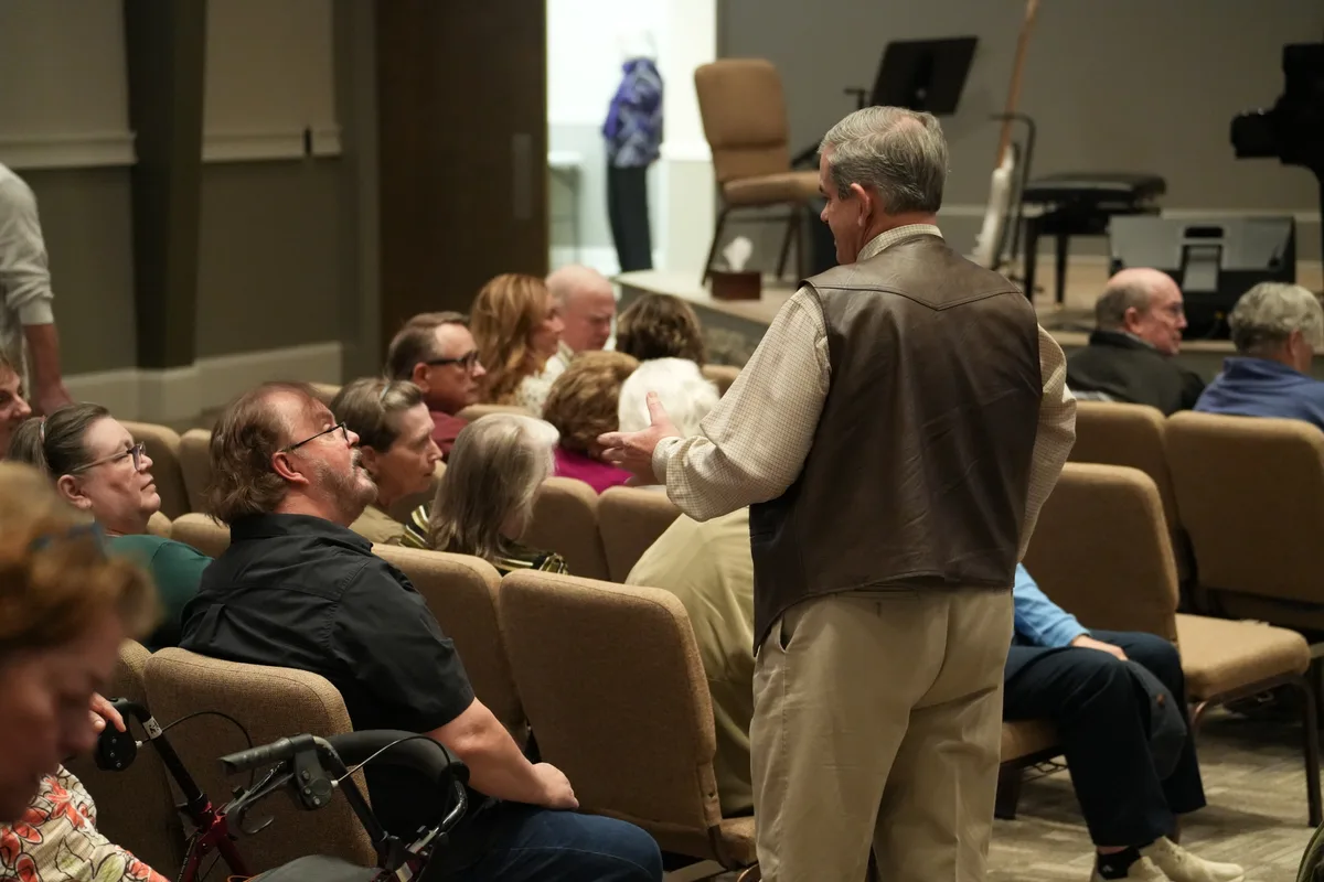 Adults gathered for a service at Calvary