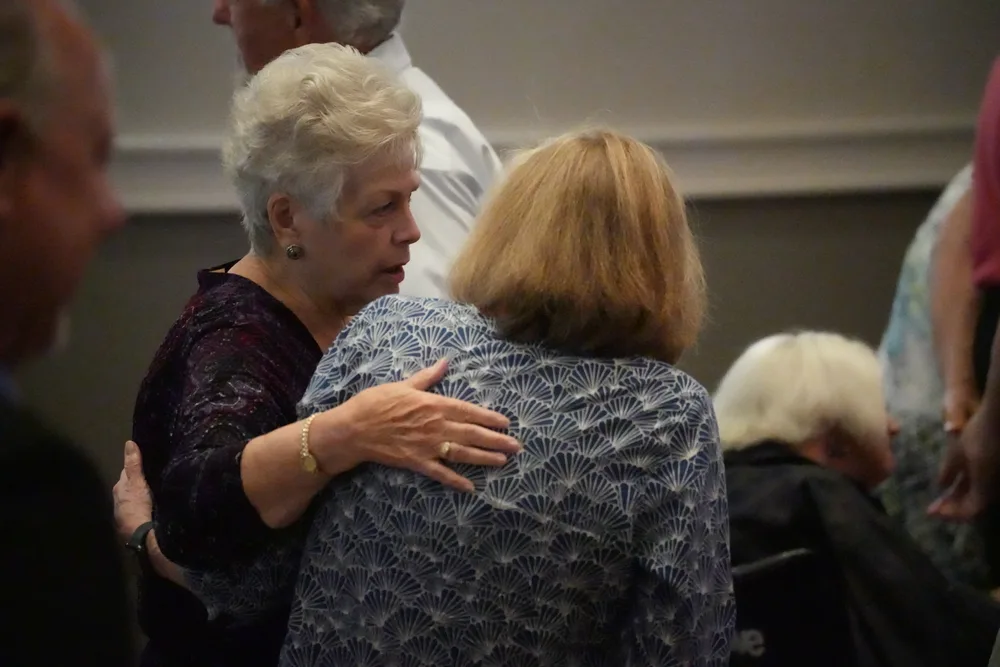 Church members greeting one another